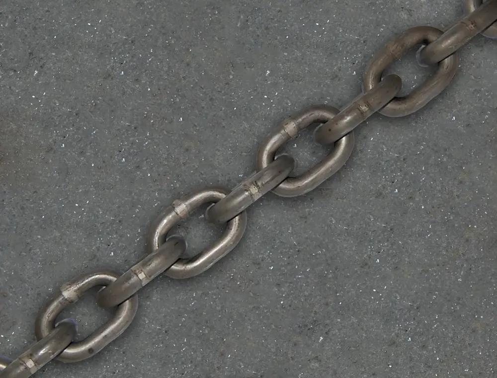 Cable or chain scraper system?